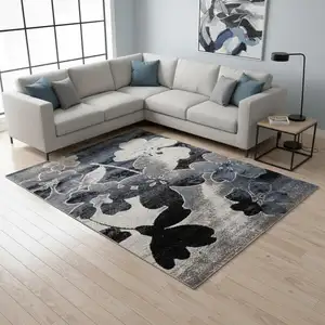 Photo of Blue Cream And Black Botanical Leaves Area Rug