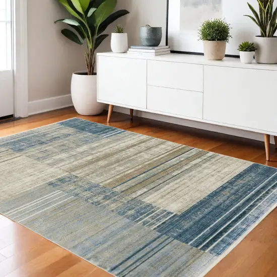 Blue Dark Blue Teal Grey Ivory Beige And Tan Geometric Power Loom Stain Resistant Area Rug With Fringe Photo 1