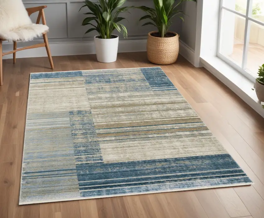 Blue Dark Blue Teal Grey Ivory Beige And Tan Geometric Power Loom Stain Resistant Area Rug With Fringe Photo 1