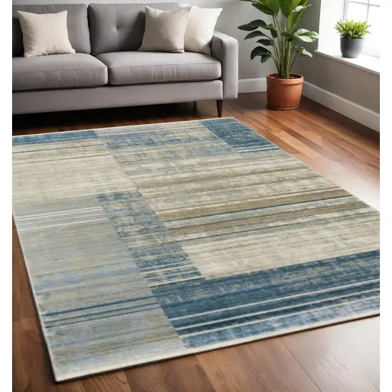 Blue Dark Blue Teal Grey Ivory Beige And Tan Geometric Power Loom Stain Resistant Area Rug With Fringe Photo 1
