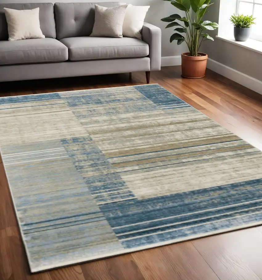 Blue Dark Blue Teal Grey Ivory Beige And Tan Geometric Power Loom Stain Resistant Area Rug With Fringe Photo 1