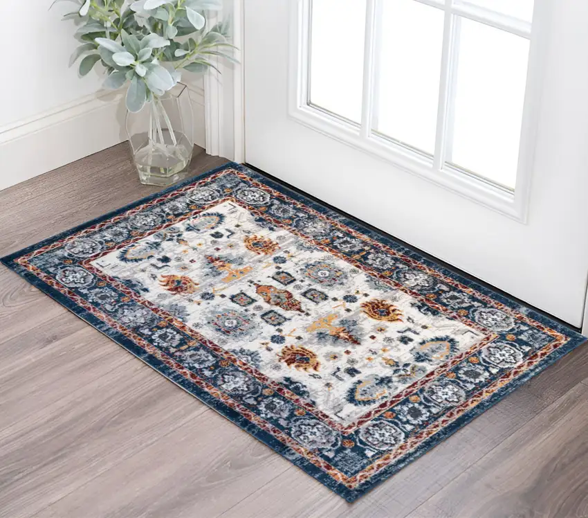 Ivory Navy and Orange Floral Power Loom Area Rug Photo 1