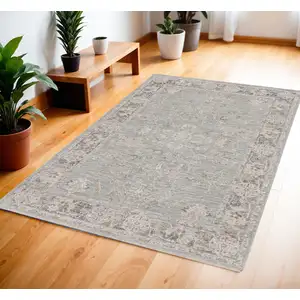 Photo of Blue Floral Power Loom Distressed Area Rug