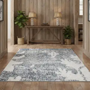 Photo of Blue Floral Power Loom Worn Faded Area Rug