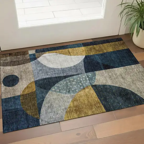 Blue Gold And Beige Abstract Geometric Washable Area Rug With UV Protection Photo 1