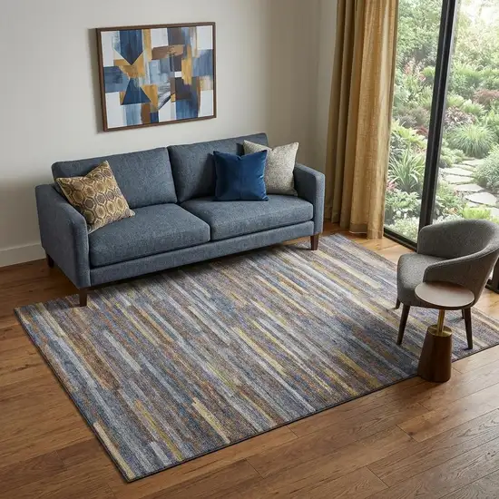 Blue Gold And Brown Abstract Washable Area Rug With UV Protection Photo 1