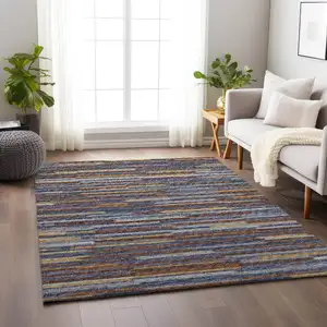 Photo of Blue Gold And Brown Abstract Washable Area Rug With UV Protection