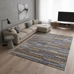 Photo of Blue Gold And Brown Abstract Washable Area Rug With UV Protection