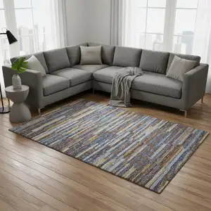 Photo of Blue Gold And Brown Abstract Washable Area Rug With UV Protection
