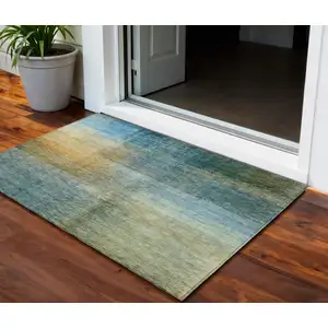 Photo of Blue Gold And Green Abstract Washable Indoor Outdoor Area Rug