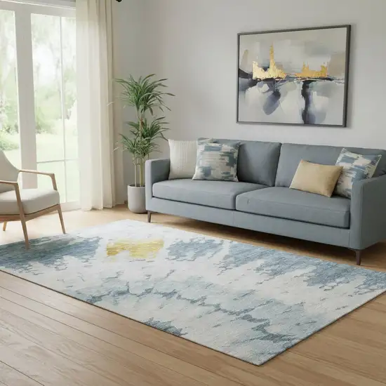 Blue Gold And Ivory Abstract Washable Area Rug With UV Protection Photo 1