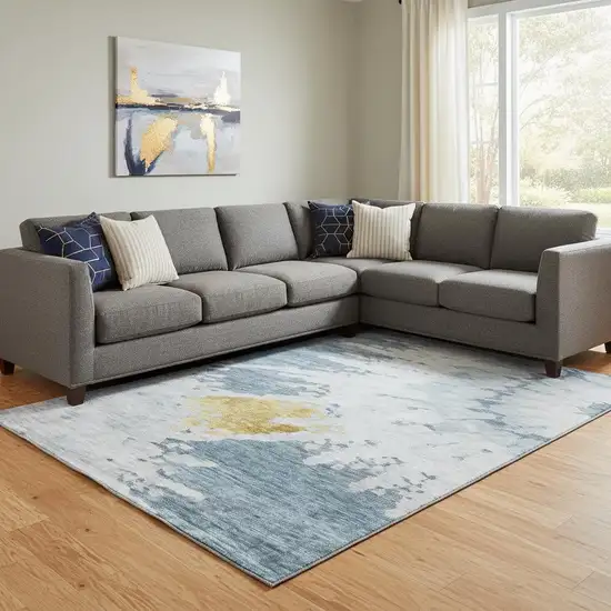 Blue Gold And Ivory Abstract Washable Area Rug With UV Protection Photo 1