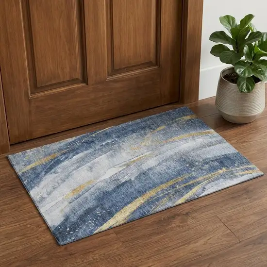 Blue Gold And Ivory Abstract Washable Area Rug With UV Protection Photo 1