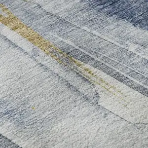 Photo of Blue Gold And Ivory Abstract Washable Area Rug With UV Protection