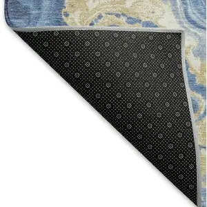 Photo of Blue Gold And Ivory Abstract Washable Area Rug With UV Protection