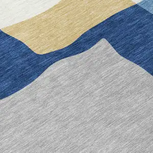 Photo of Blue Gold And Ivory Abstract Washable Indoor Outdoor Area Rug