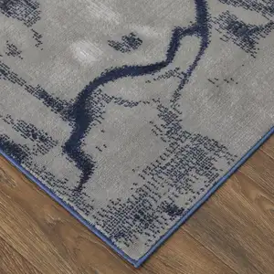 Photo of Blue Gray And Ivory Abstract Power Loom Stain Resistant Area Rug