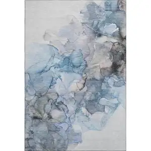 Photo of Blue Gray And Ivory Abstract Washable Area Rug With UV Protection