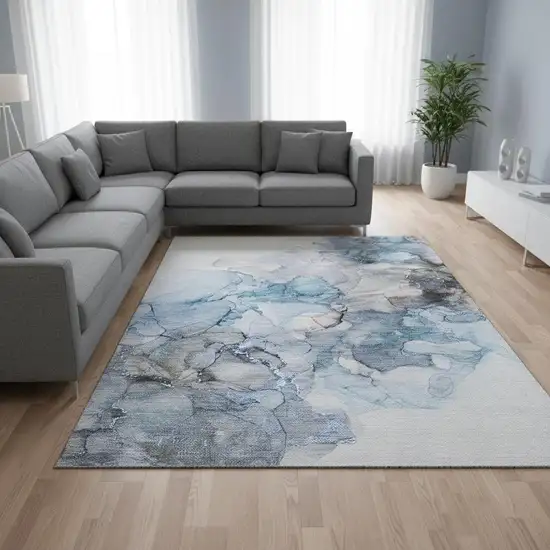 Blue Gray And Ivory Abstract Washable Area Rug With UV Protection Photo 1