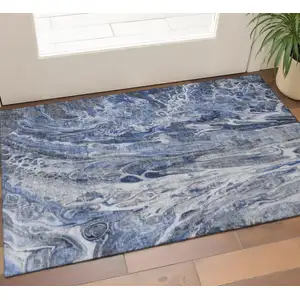 Photo of Blue Gray And Ivory Abstract Washable Area Rug With UV Protection