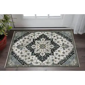 Photo of Blue Gray And Ivory Medallion Area Rug With Fringe