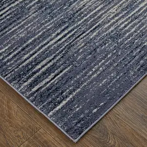 Photo of Blue Gray And Ivory Striped Power Loom Distressed Area Rug