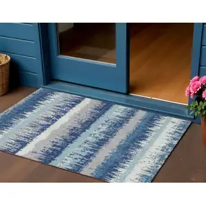 Photo of Blue Gray And Ivory Striped Washable Indoor Outdoor Area Rug