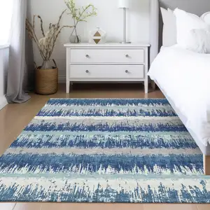 Photo of Blue Gray And Ivory Striped Washable Indoor Outdoor Area Rug