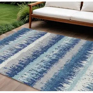 Photo of Blue Gray And Ivory Striped Washable Indoor Outdoor Area Rug