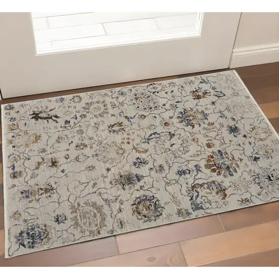 Ivory Blue And Burnt Orange Floral Distressed Area Rug With Fringe Photo 1