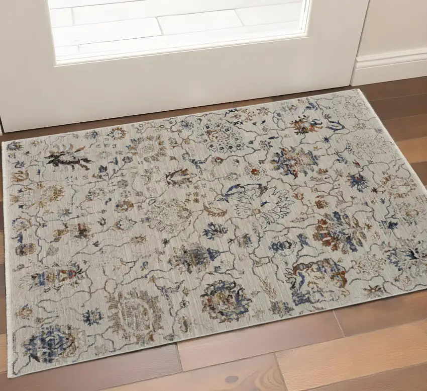 Ivory Blue And Burnt Orange Floral Distressed Area Rug With Fringe Photo 1