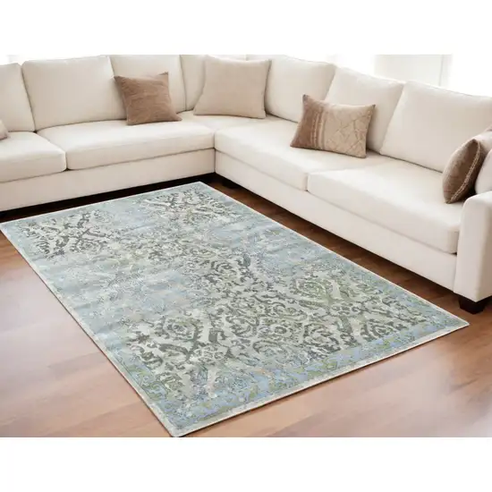 Blue Gray and Green Floral Power Loom Worn Faded Area Rug Photo 1