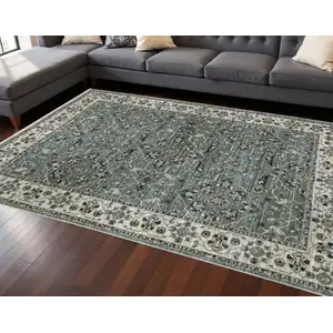Photo of Blue Green And Beige Floral Area Rug With Fringe