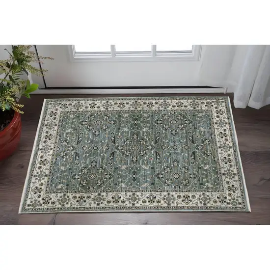 Blue Green And Beige Floral Area Rug With Fringe Photo 1