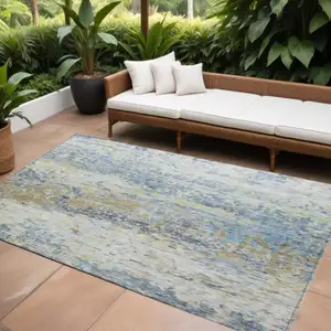Photo of Blue Green And Ivory Abstract Washable Indoor Outdoor Area Rug
