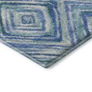 Photo of Blue Green And Ivory Geometric Washable Area Rug With UV Protection
