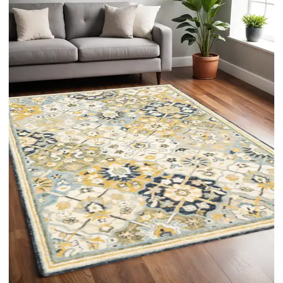 Blue Green Gold Navy And Ivory Geometric Tufted Handmade Stain Resistant Area Rug Photo 1