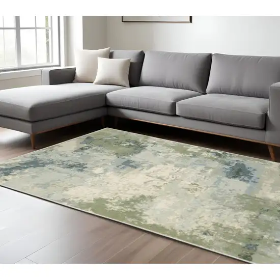 Green And Ivory Abstract Area Rug Photo 1