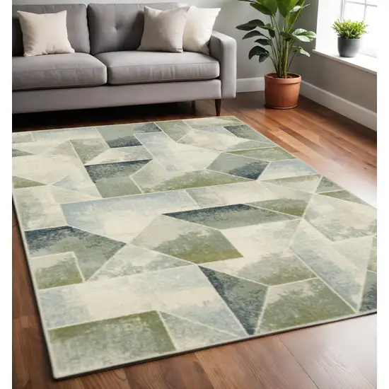 Blue Green Grey Gold And Ivory Geometric Power Loom Stain Resistant Area Rug Photo 1