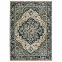 Photo of Blue Grey Beige Tan Green And Gold Oriental Power Loom Stain Resistant Area Rug With Fringe