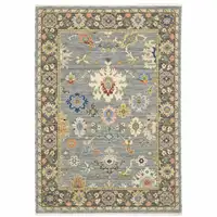 Photo of Blue Grey Gold Green Pink Orange Ivory And Red Oriental Power Loom Stain Resistant Area Rug With Fringe