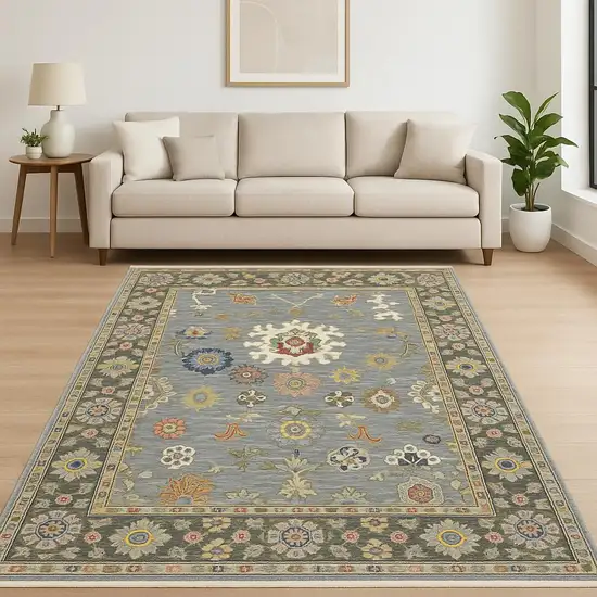 6' X 9' Blue Grey Gold Green Pink Orange Ivory And Red Oriental Power Loom Stain Resistant Area Rug With Fringe Photo 1