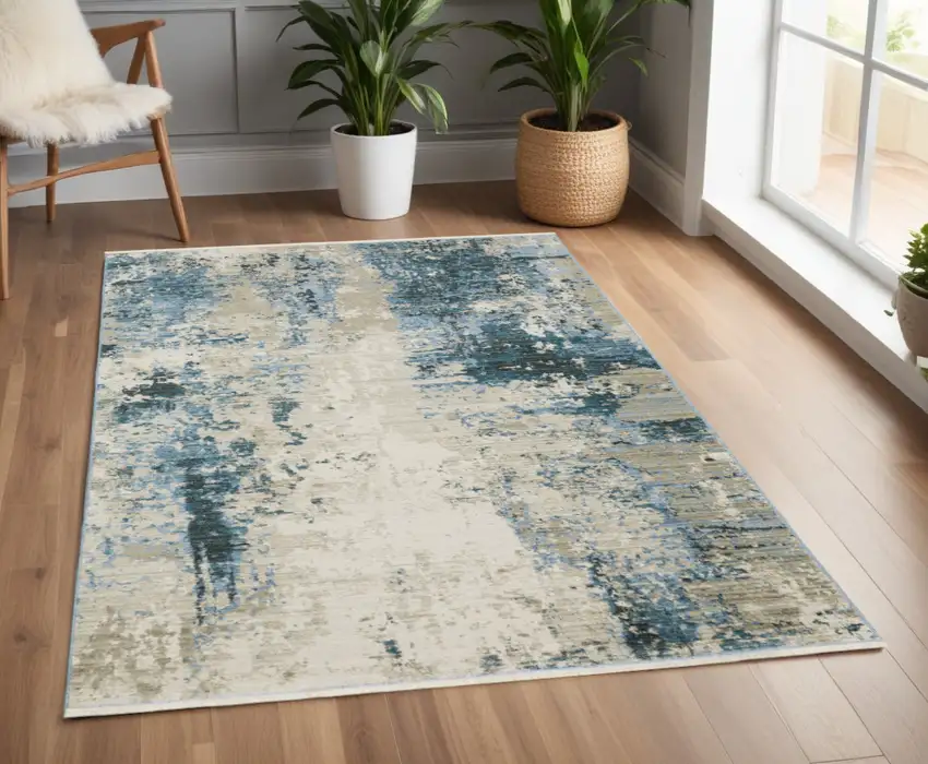 Blue Grey Ivory Light Blue And Dark Blue Abstract Power Loom Stain Resistant Area Rug With Fringe Photo 1