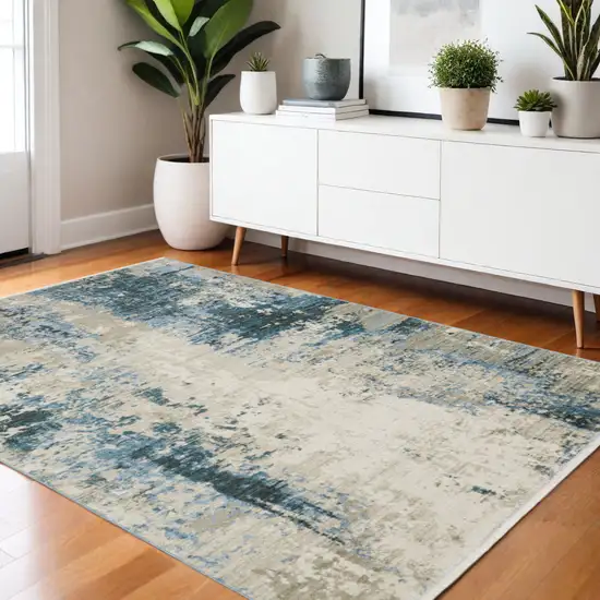 Blue Grey Ivory Light Blue And Dark Blue Abstract Power Loom Stain Resistant Area Rug With Fringe Photo 1