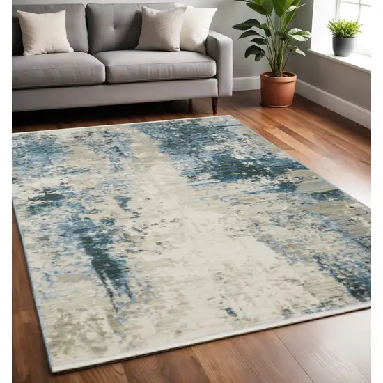 Blue Grey Ivory Light Blue And Dark Blue Abstract Power Loom Stain Resistant Area Rug With Fringe Photo 1