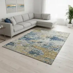 Photo of Blue Ivory And Gold Abstract Washable Area Rug With UV Protection