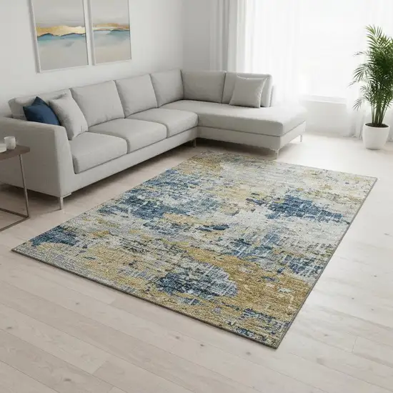 Blue Ivory And Gold Abstract Washable Area Rug With UV Protection Photo 1