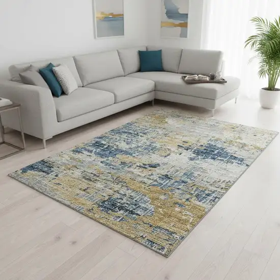 Blue Ivory And Gold Abstract Washable Area Rug With UV Protection Photo 1