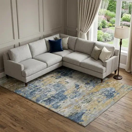Blue Ivory And Gold Abstract Washable Area Rug With UV Protection Photo 1