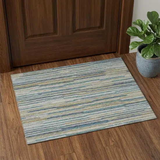 Blue Ivory And Gold Abstract Washable Area Rug With UV Protection Photo 1